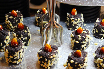 Fototapeta na wymiar Chocolate truffles with nuts