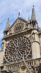 Fototapeta na wymiar Photo of famous Notre Dame cathedral on a cloudy spring morning, Paris, France