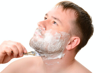 A man shaves on a white background
