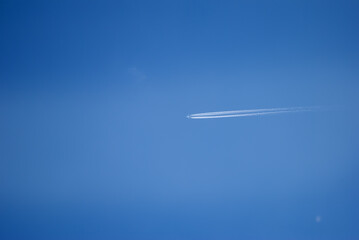 airplane on blue sky. far away