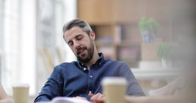 Businessman thinking in a meeting