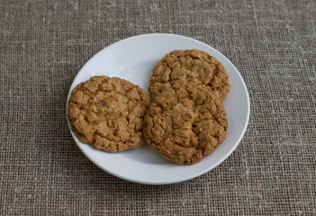 Cookies on a white plate. Background burlap