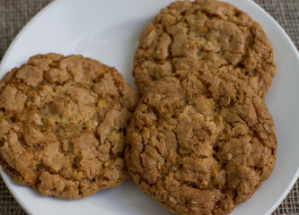 Cookies on a white plate. Background burlap