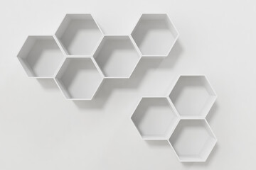 Obraz na płótnie Canvas Empty white wall with hexagon shelves on the wall, 3D rendering