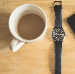 Coffee and wristwatch