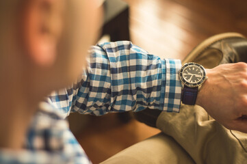 Man checking time on wristwatch