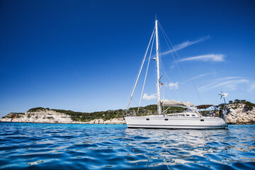 Beautiful bay with sailing boat in Mediterranean sea. Sailing, yachting concept