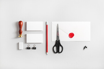 Photo of blank stationery set on paper background. Responsive design mockup for placing your design. ID template. Top view.