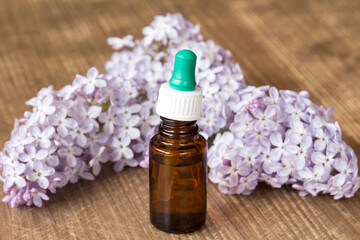 Fototapeta na wymiar Essential aroma oil with lilac
