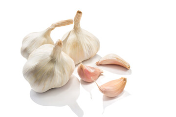 Garlic heads and cloves isolated on white background