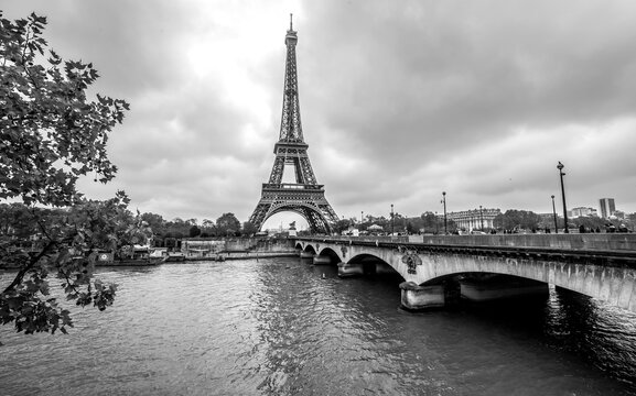 Paris Eiffel Tower from Seine. Cityscape in black and white