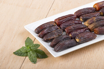 Dried dates in a white plate for iftar in Ramadan