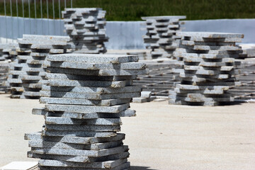 Stacks of paving tiles and flagstones. Sidewalk reconstruction.