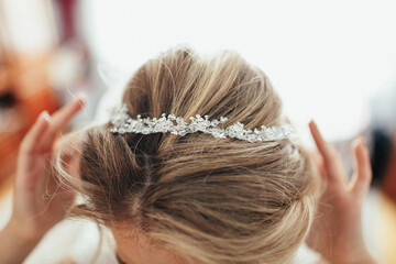 Fototapeta premium Look from above at crystal wreath on bride's head