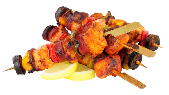 Chicken and spicy chorizo sausage kebabs with sweet peppers isolated on a white background