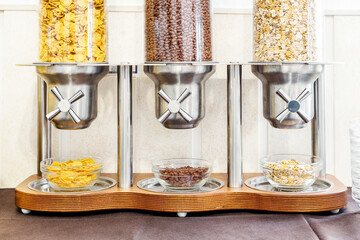 cereal dispenser. Self service hotel breakfast © darkside17