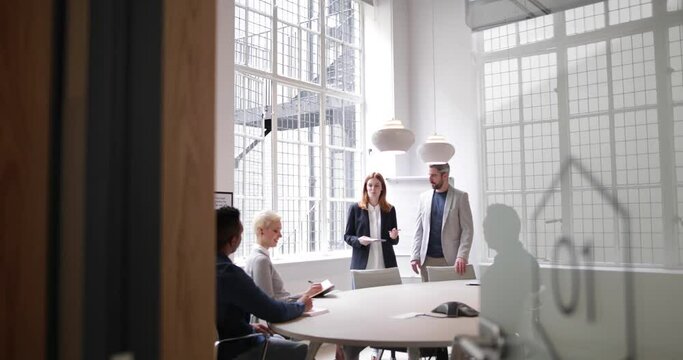 Business executives leading a brainstorm meeting