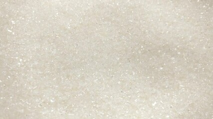 Great background of White Sugar crystals rotating close up. Footage will work great for any videos dealing with cooking, medicine, healthy nutrition and much more.