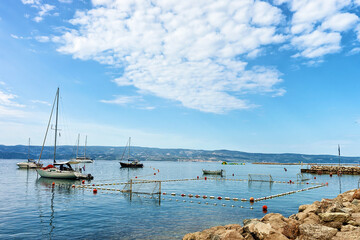 Fototapeta na wymiar Boats and water polo playground in Omis