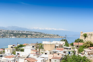 View from the top to the Greek city and the ocean
