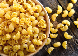 macaroni in bowl on wood