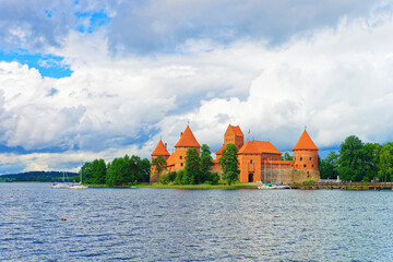 Naklejka na ściany i meble People and Sailing boats in Galve lake Trakai island castle