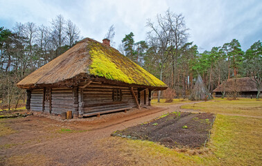 Fototapeta na wymiar Old wooden house in Ethnographic open air village Riga