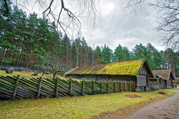 Old building and wooden fence in Ethnographic village in Riga