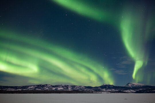 Aurora borealis Northern Lights snowy winter scene
