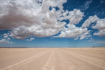 Zelfklevend Fotobehang vibrant image of desert road and blue cloudy sky © javarman