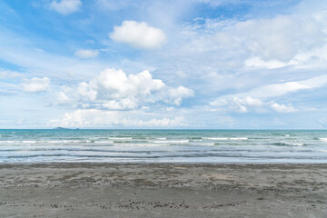 Fototapeta na wymiar Ocean tropical beach with waves, sand and blue sky in summer.