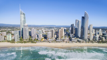 Obraz premium Aerial view looking towards Gold Coast Surfers Paradise cityscape and beach from over the ocean.