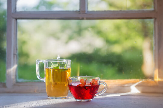 tea in glass cup on old  windowsill
