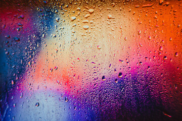 Raindrops on a blurred multicolored background