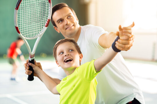 Happy Child Playing Sport Game With His Parent