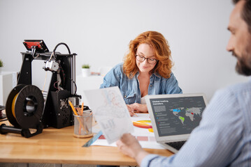 Serious hard working man analyzing statistical data