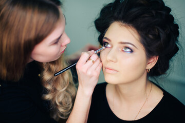 stylist working in a beauty salon and a nice lady