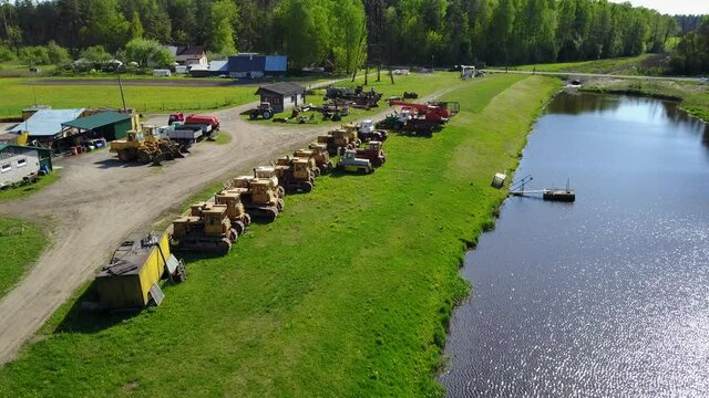 Tractors bulldozer technics at lake coast Aerial view, drone top view