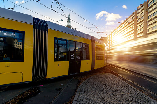Modern electric tram yellow color on the streets of Berlin