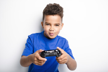 young child having fun playing video games