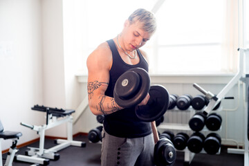 Naklejka na ściany i meble Man workout at gym