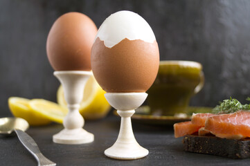 Healthy Breakfast - a soft boiled egg with bread and salmon - healthy Breakfast. Selective focus