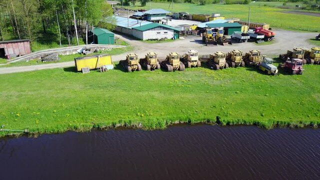 Tractors bulldozer technics at lake coast Aerial view, drone top view