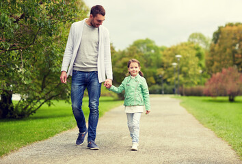 happy family walking in summer park