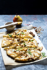 Homemade pizza with pear and gorgonzola on a gray table - 157417086