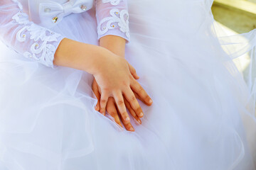 Fototapeta na wymiar Child hands white dress