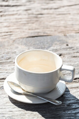 relax time,Coffee stain on empty cup of coffee with wood background and texture in morning sun light