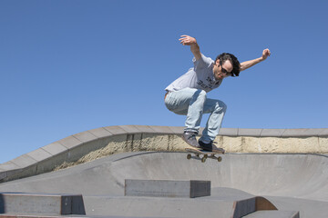Skateboarder in mid air action