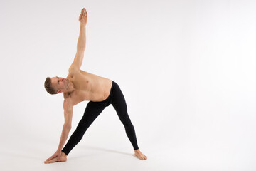 Naklejka premium Flexibility. Fitness and healthy lifestyle. Sexy man and a healthy lifestyle. Sport and strength. 