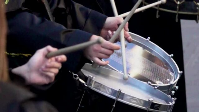 Close-up of hands playing drums